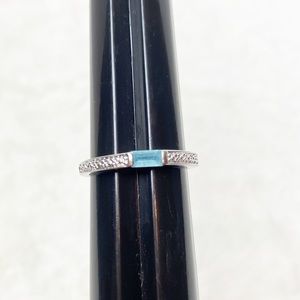 Thin silver tone and blue stone ring